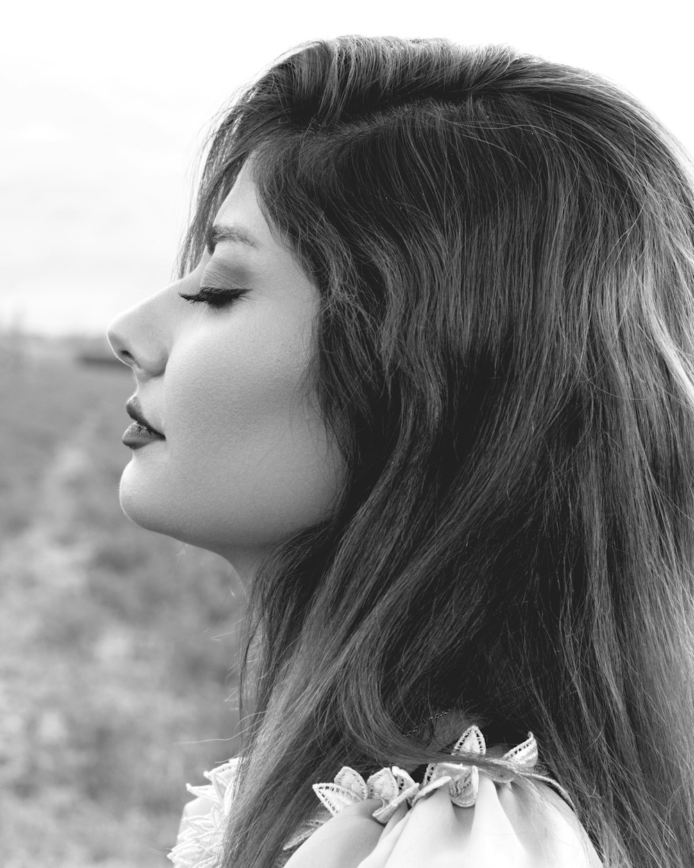 grayscale photo of woman with long hair