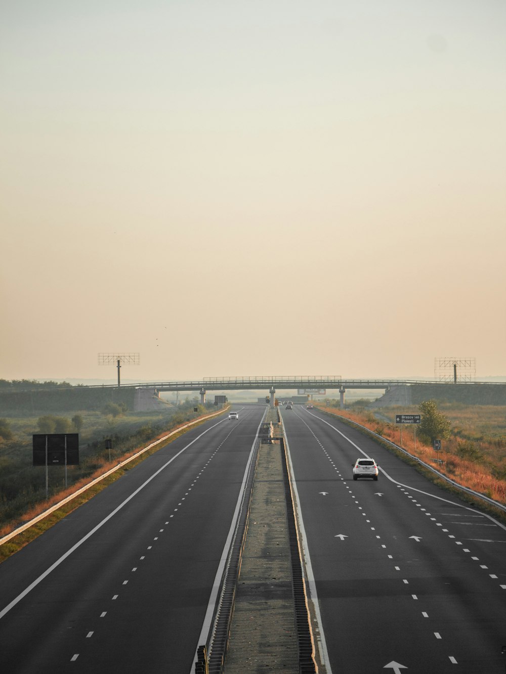 gray concrete road under white sky during daytime