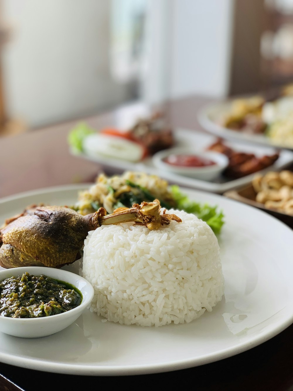 rice with meat on white ceramic plate