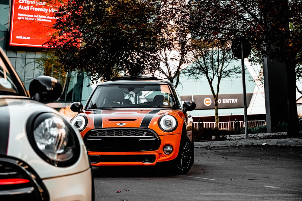 orange and white car on road during daytime