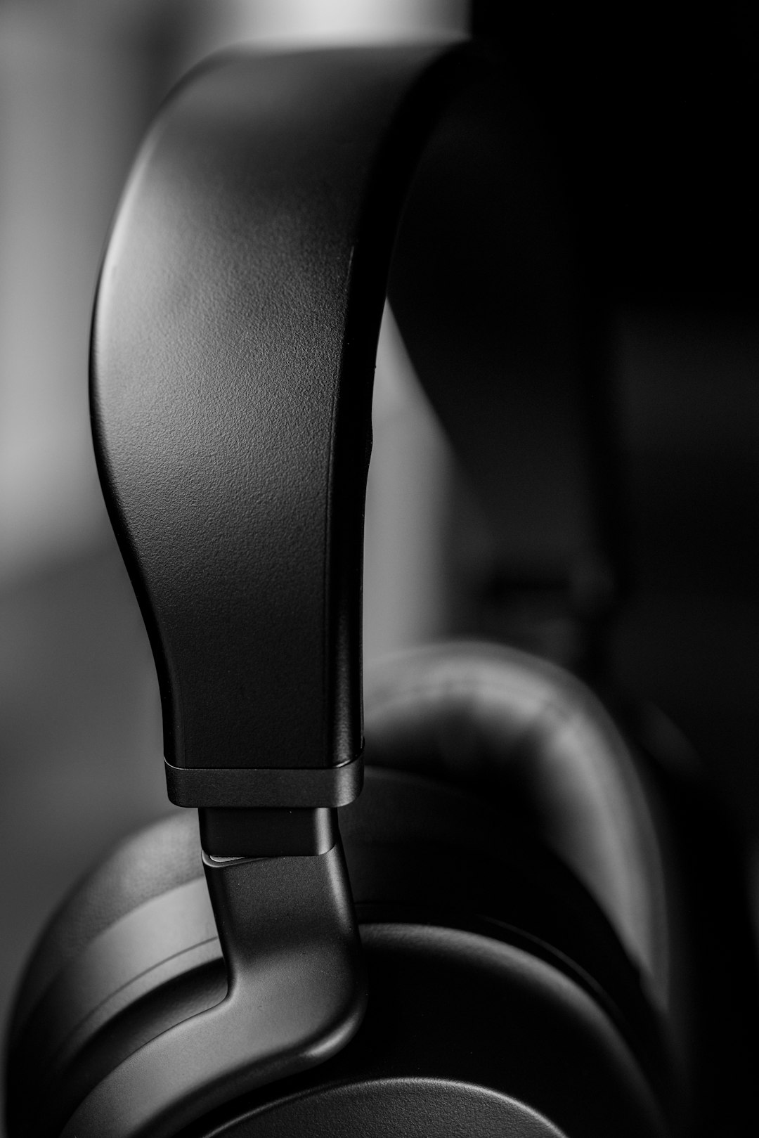 black car steering wheel in grayscale photography