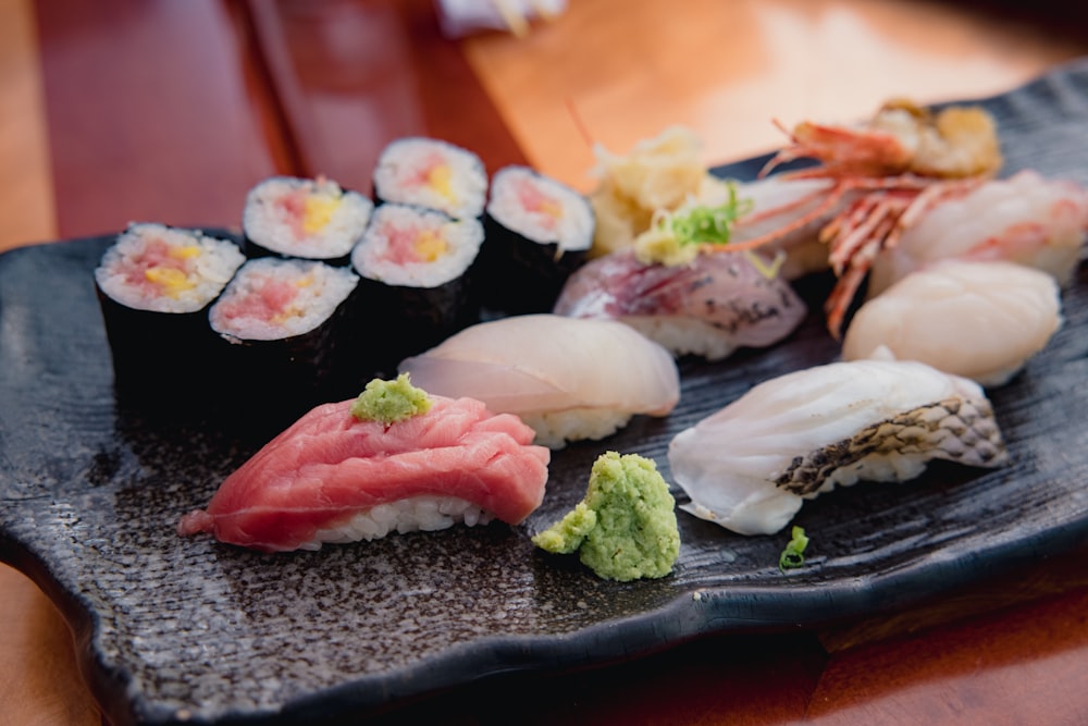 sushi on black ceramic plate