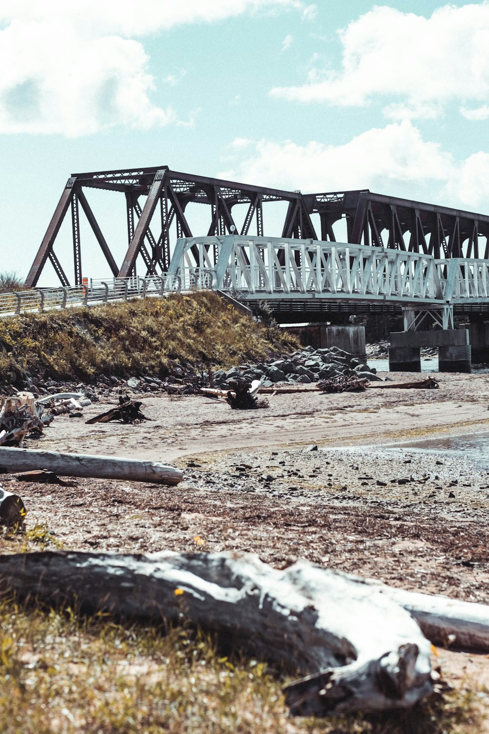 gray metal bridge over river during daytime