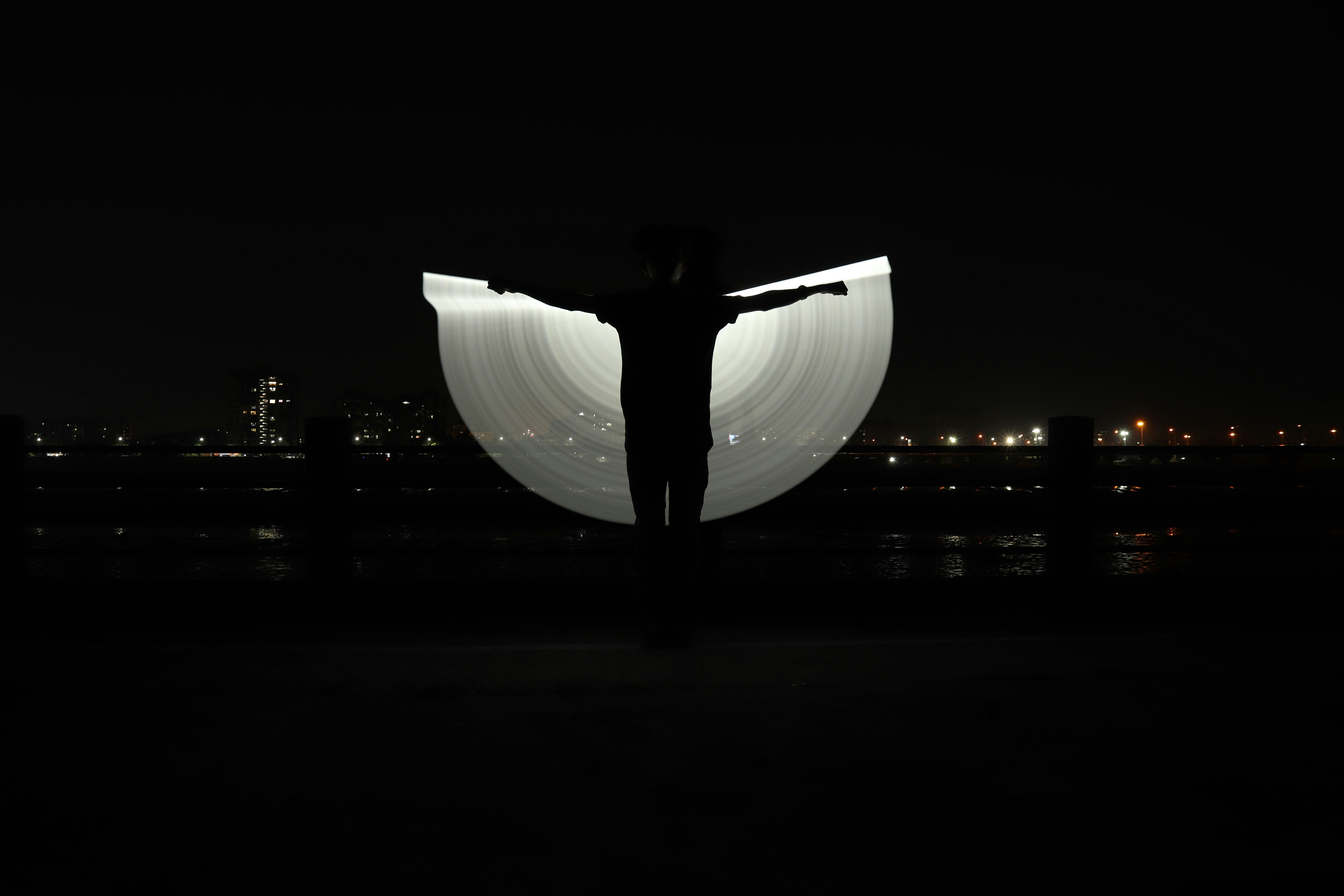 white light fixture turned on during night time luminescence teams background