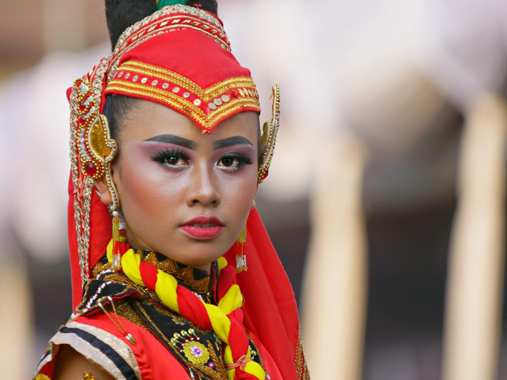 woman in red and gold traditional dress