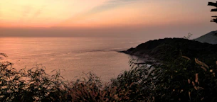 A serene coastal view of a luxury Philippine shoreline at sunset, reflecting calm and legacy.