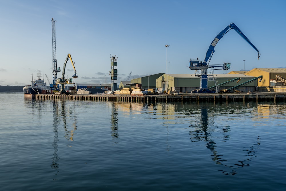 white and blue ship on dock during daytime