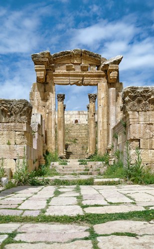 Historic stone ruins bathed in golden afternoon light at a heritage site