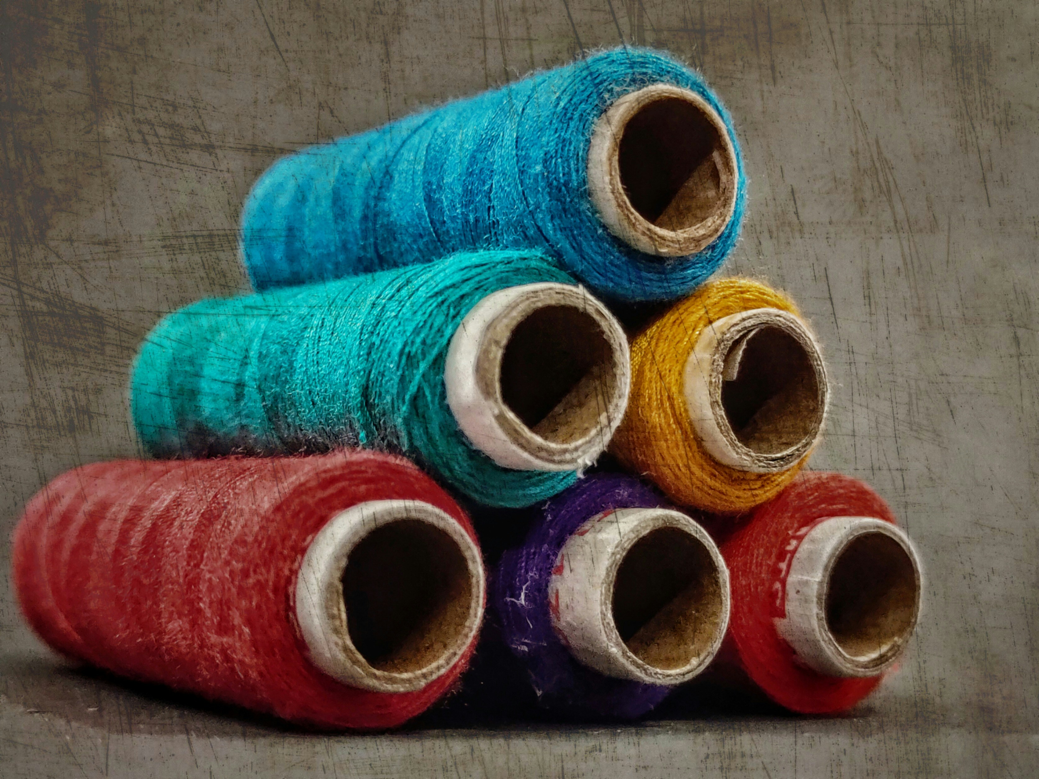 Vibrant spools of thread in rainbow colors