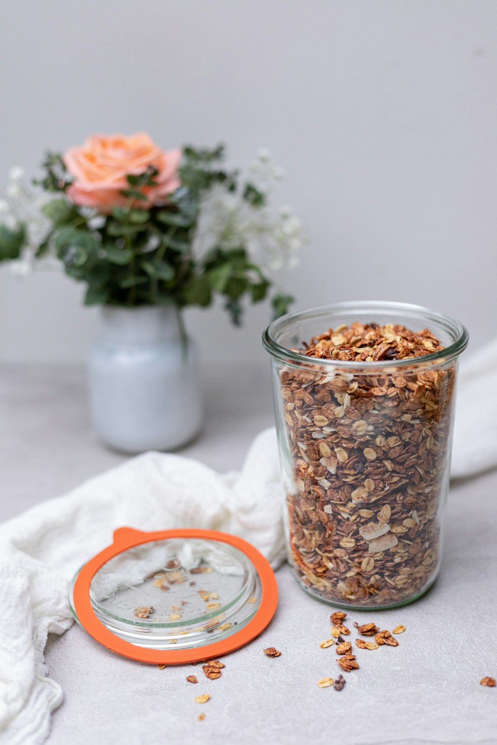 brown and white food in clear glass jar