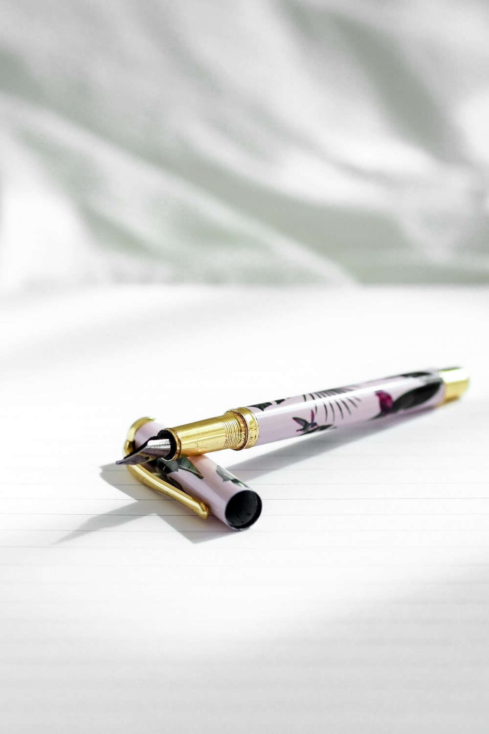 gold and silver click pen