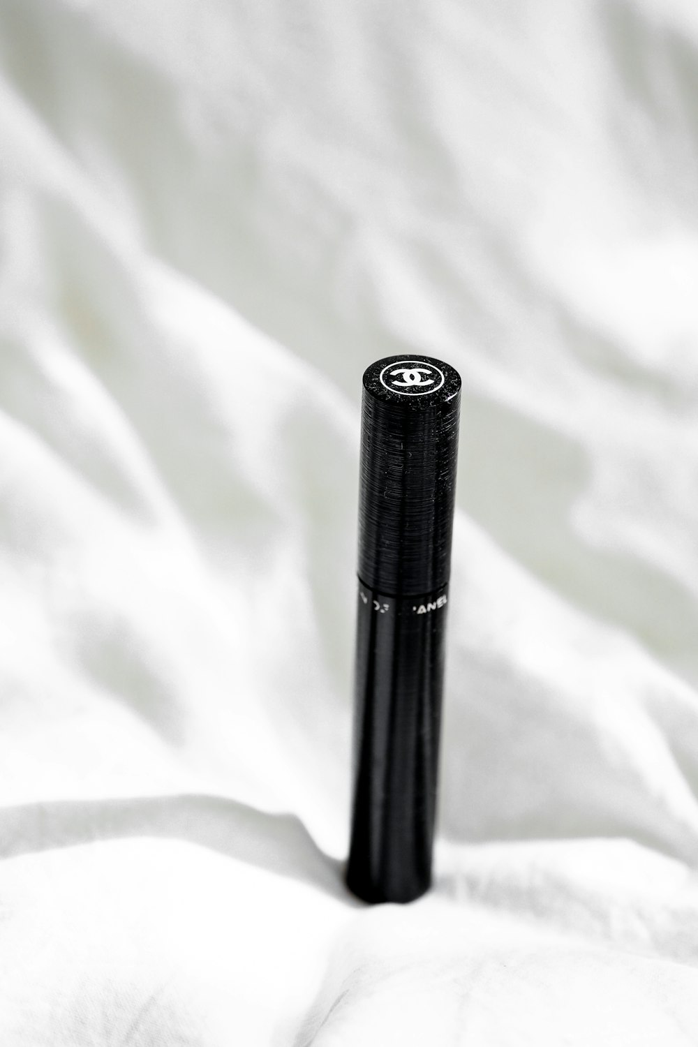 black tube on white textile