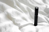 Sensevoxx device resting on a soft blanket with natural light highlighting its sturdy design.