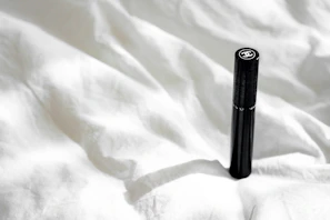 High-quality photograph of a sleek, dark-toned product illuminated to highlight texture and detail