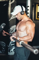 topless man doing biceps gym massage 