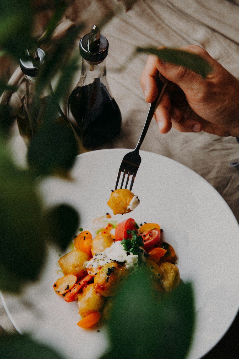 person holding stainless steel fork