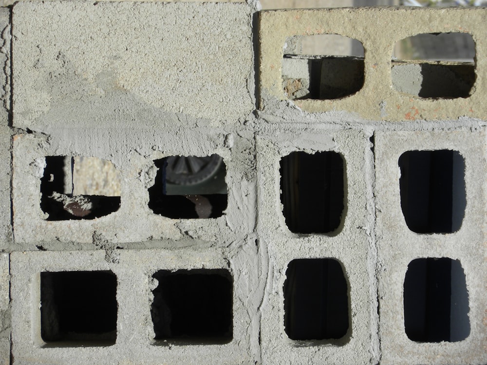 black rectangular plastic on white concrete
