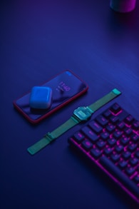 blue apple watch with green strap