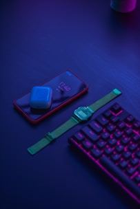 blue apple watch with green strap