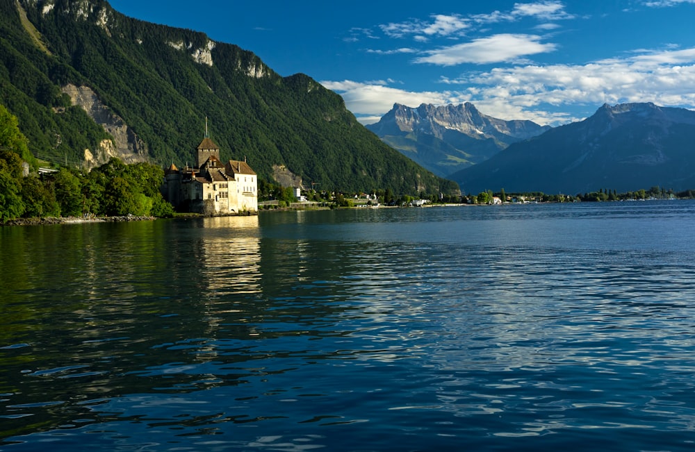 white concrete building on island surrounded by water