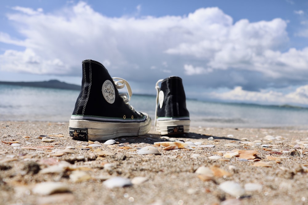Black and white converse all star high top sneakers on brown sand photo –  Free Grey Image on Unsplash