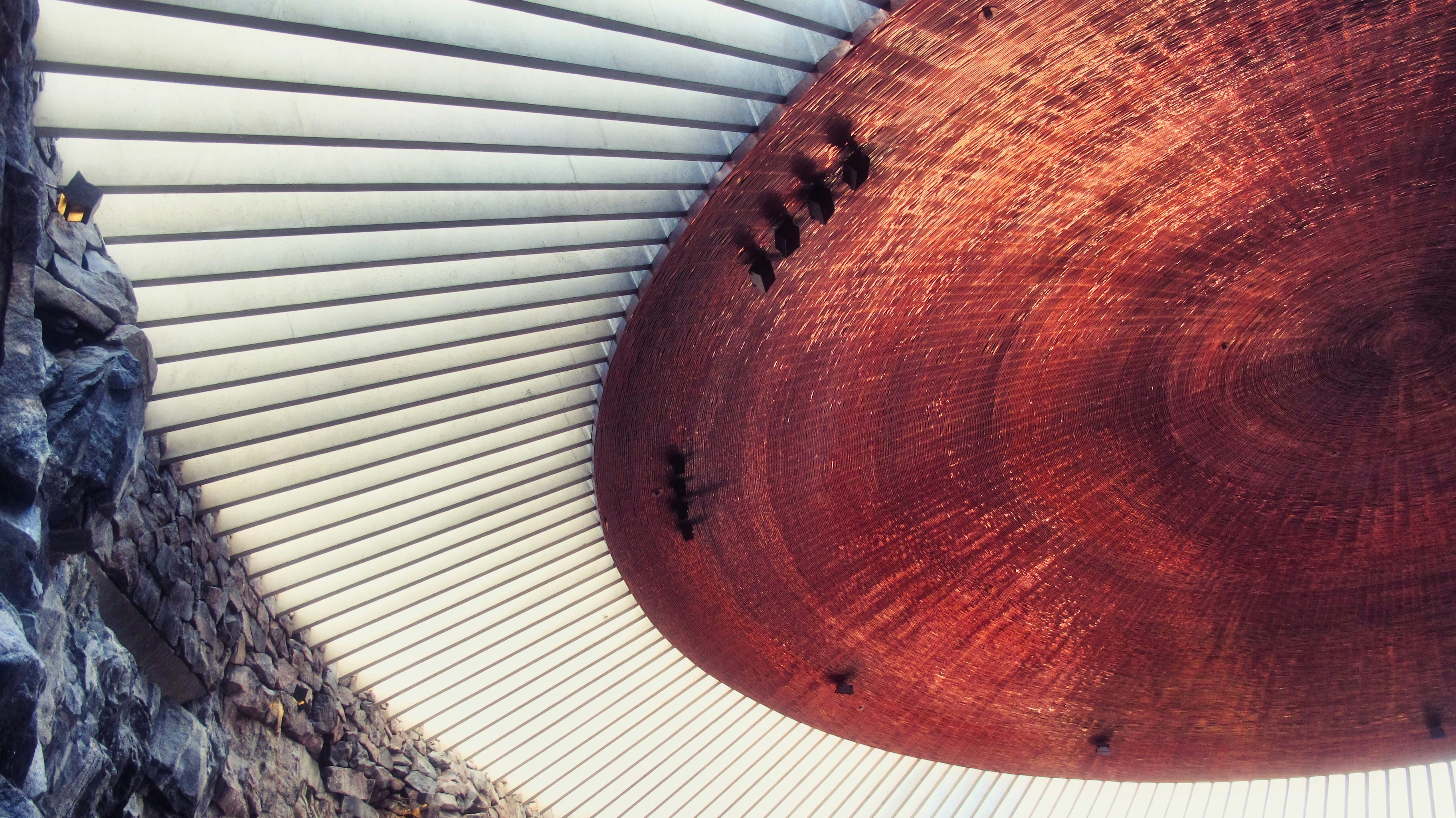 brown round wooden table on white wooden floor