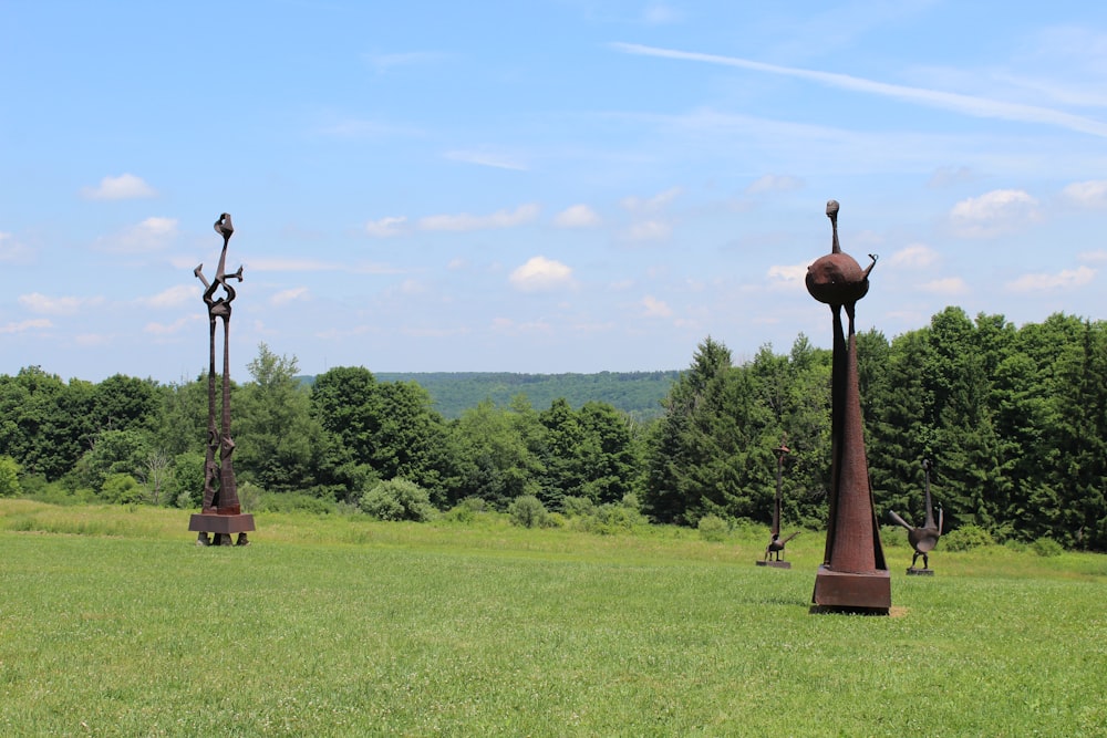 brown wooden stand on green grass field during daytime