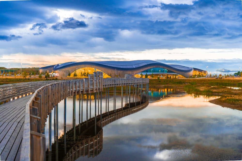 gray wooden bridge over river during daytime