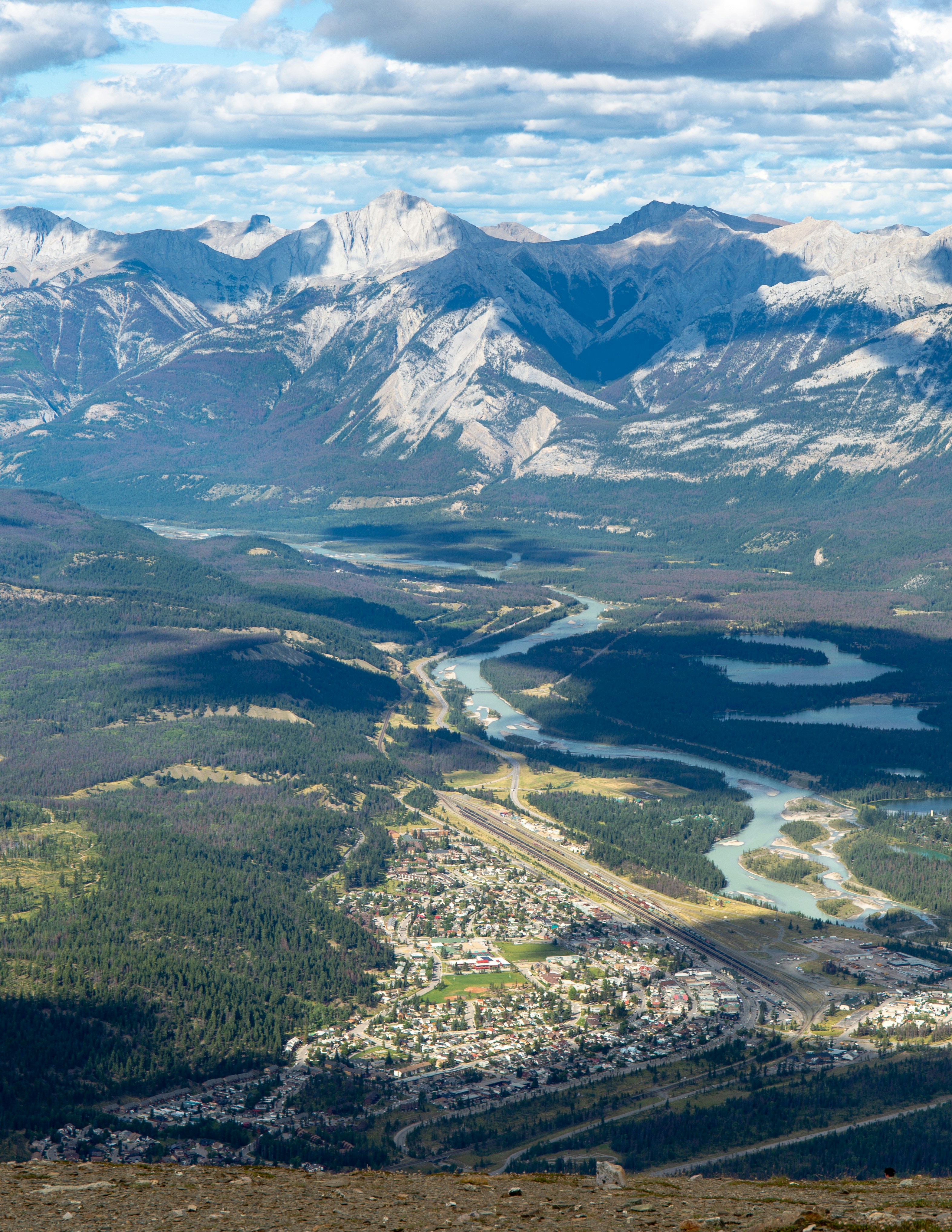 green grass field and mountains during daytime