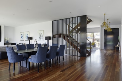 Spacious open-concept dining area with elegant hardwood floors.