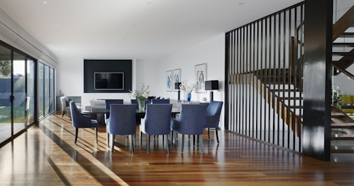 white and blue chairs beside white table