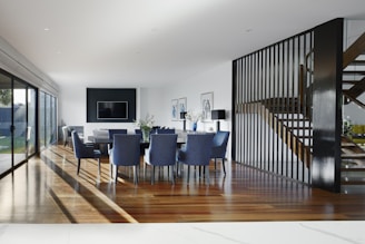 white and blue chairs beside white table
