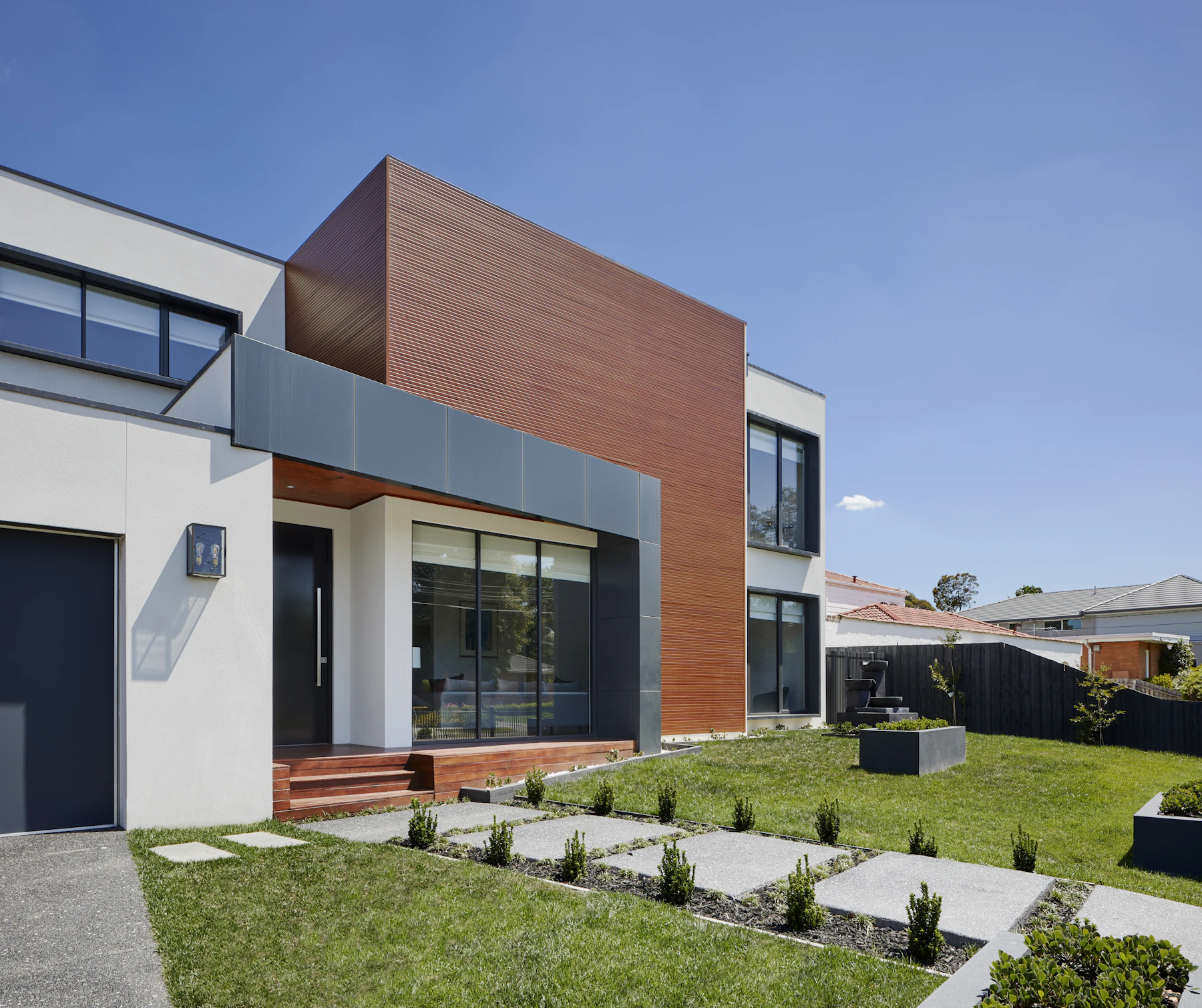 Modern architectural home exterior with warm wood cladding