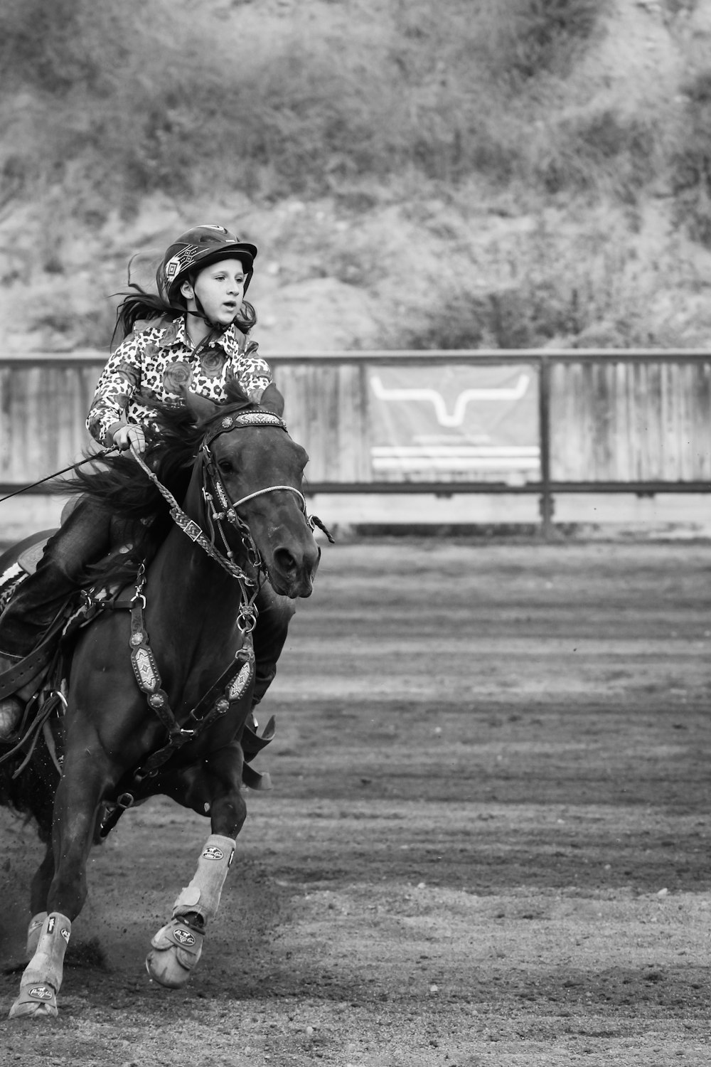 grayscale photo of man riding horse