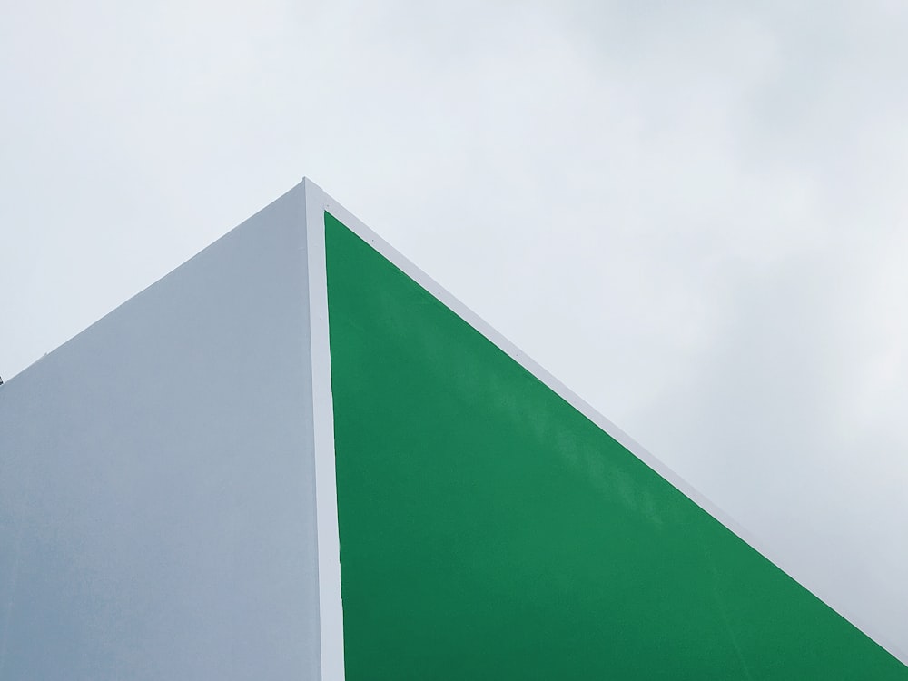 green and white concrete building under white sky during daytime