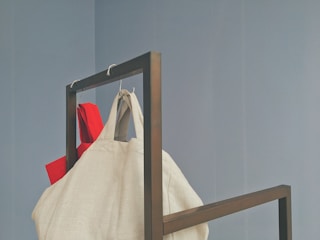 Close-up of a durable woven filter bag hanging in a factory setting.