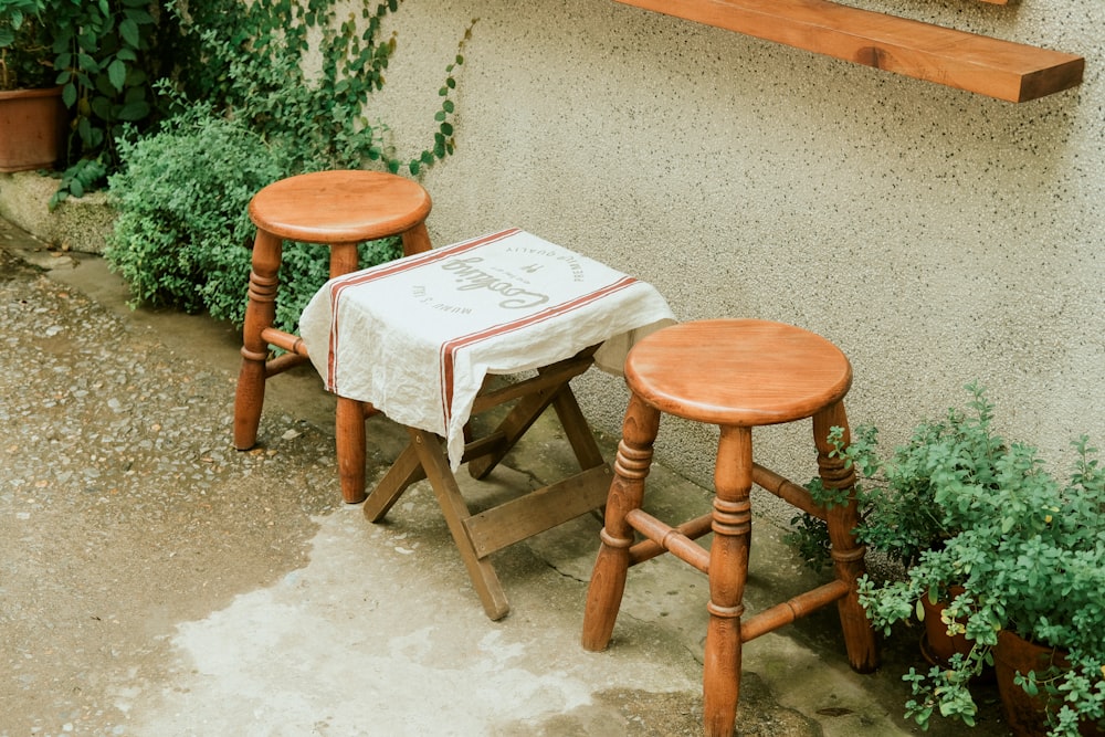 brown wooden seat beside brown wooden table