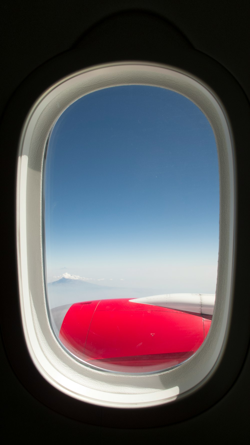 white and red airplane wing during daytime
