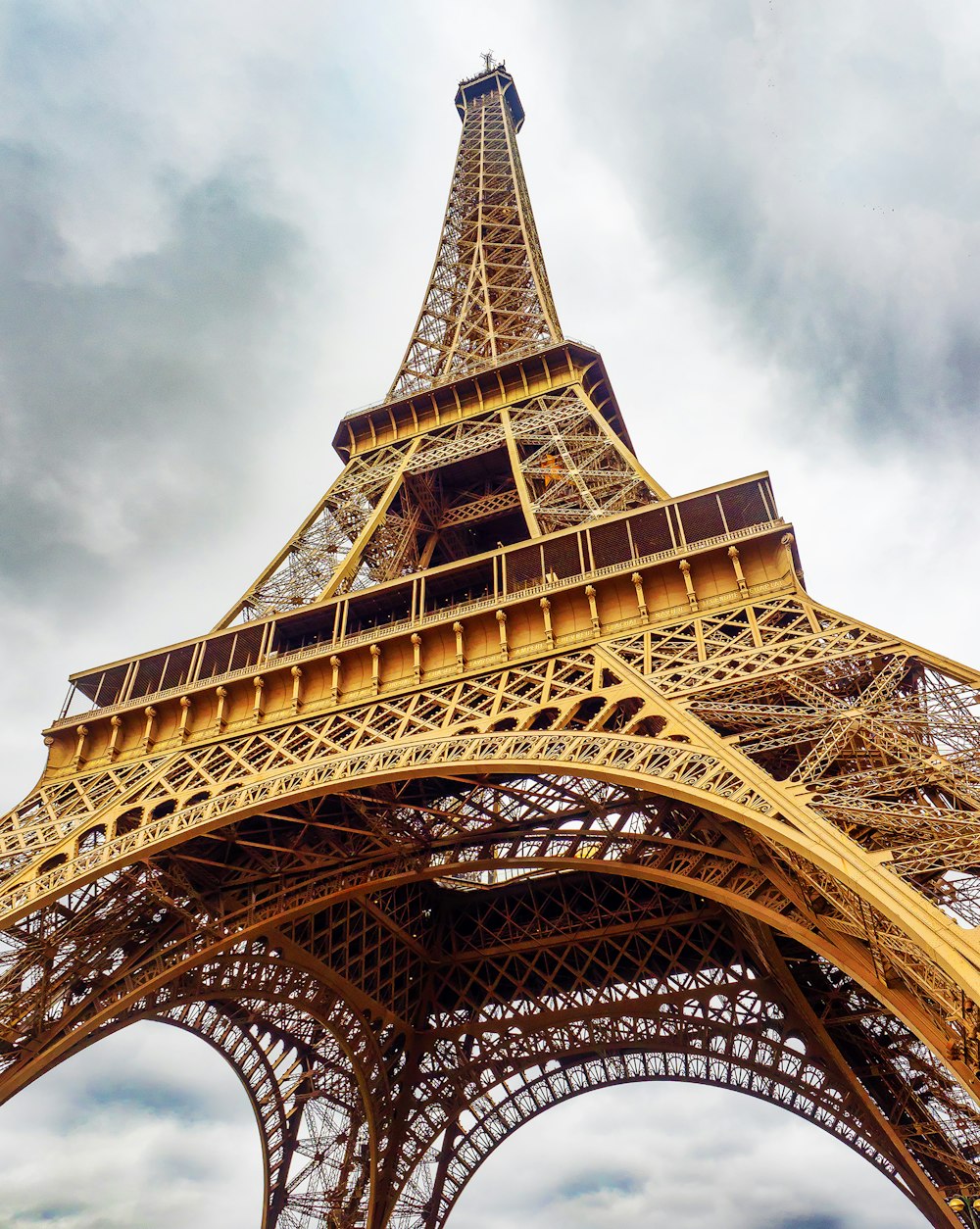 eiffel tower under white clouds during daytime