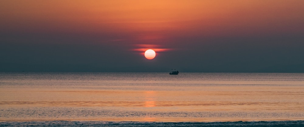 body of water during sunset