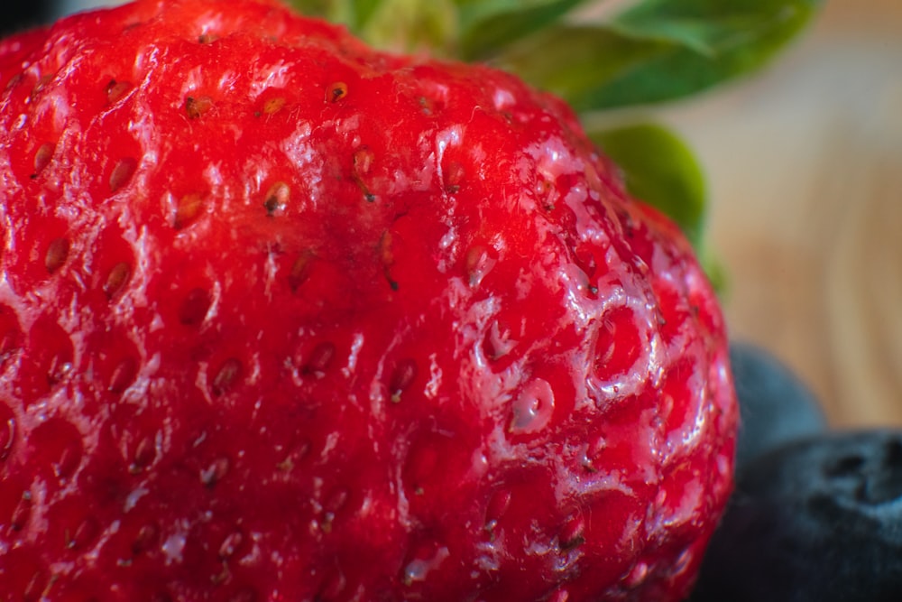 red strawberry fruit in close up photography