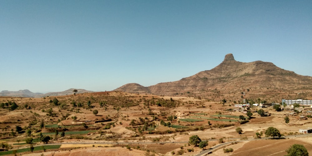 brown mountains under blue sky during daytime