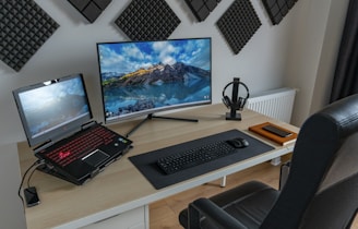 black and silver laptop computer on brown wooden table