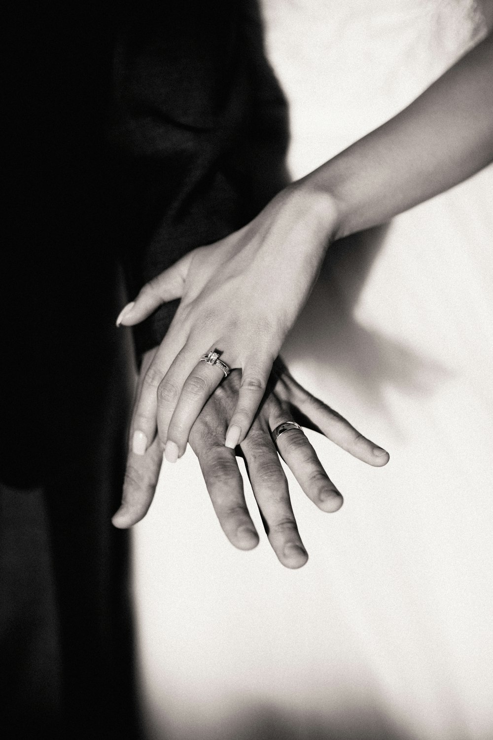 persons hand on white textile