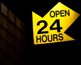 sign reading open twenty four hours