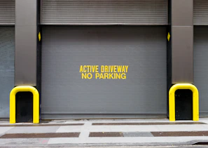 yellow and black caution wet floor sign