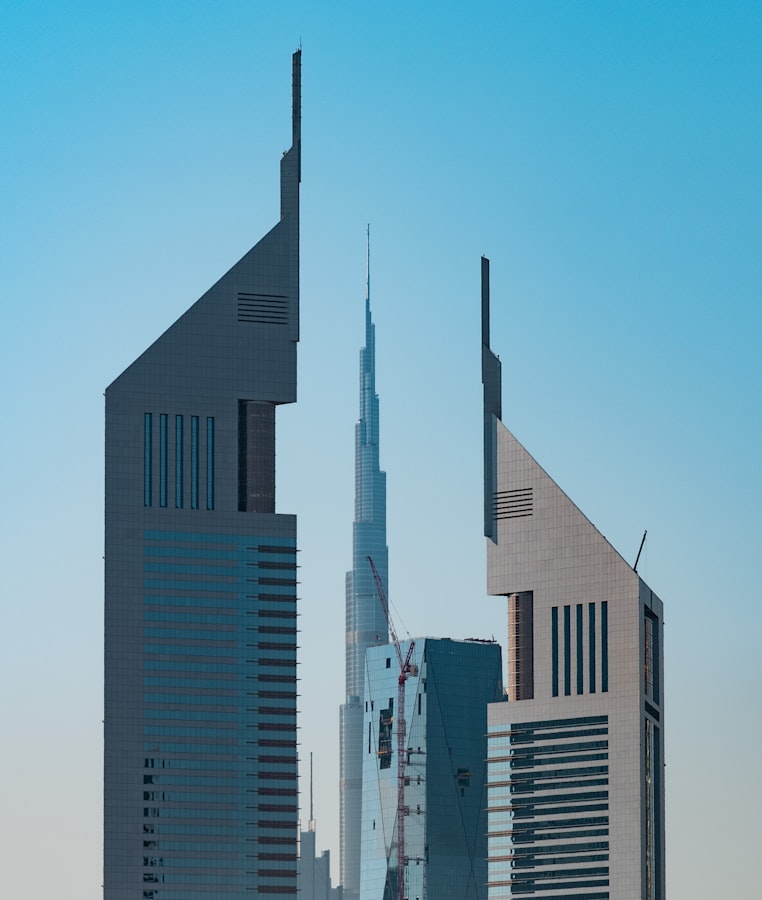 The Emirates Towers rise beside the Burj Khalifa in Dubai's financial district skyline.