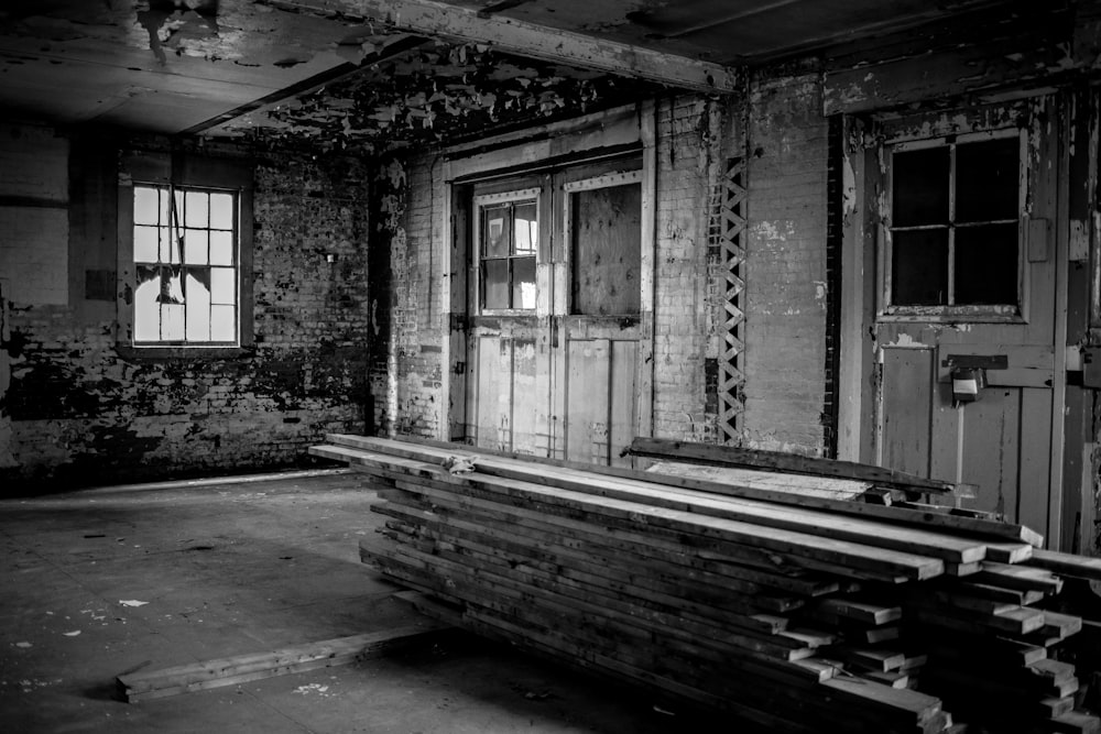 grayscale photo of wooden door