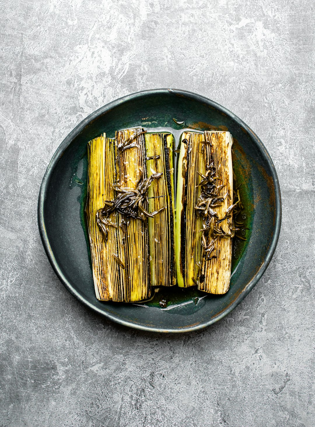 brown wooden sticks on round black ceramic plate