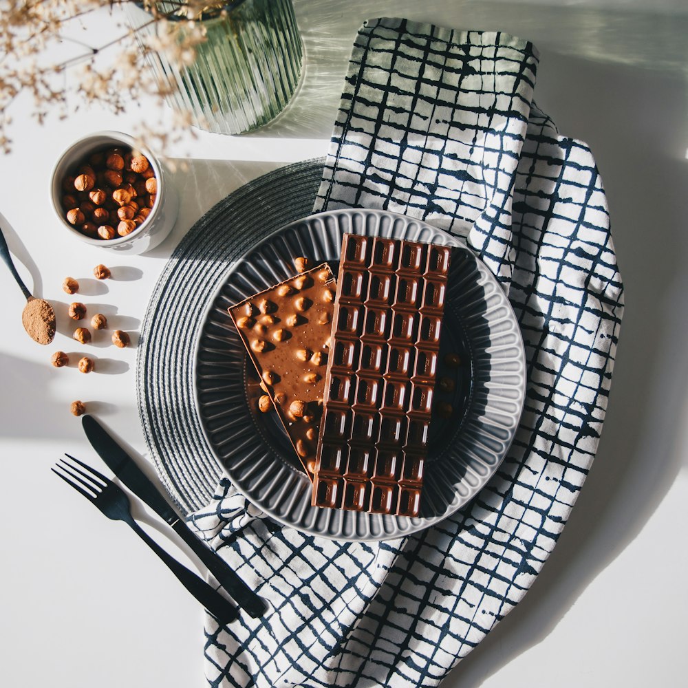 stainless steel fork and knife on white round plate